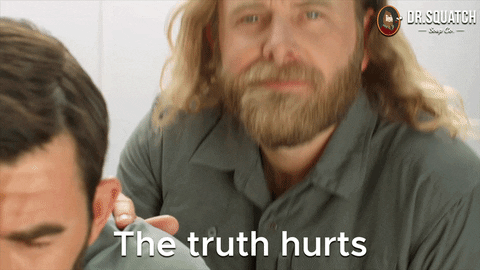 Ad gif. James Schrader in a Dr. Squatch Soap Co commercial pats another man on the shoulder and then looks at us as he says, "The truth hurts." 