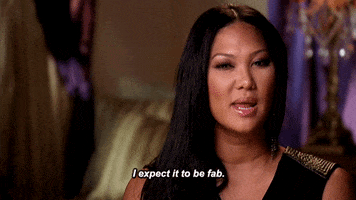 Reality TV gif. Talking head of Kimora Lee Simmons in Life in the Fab Lane as she squints and asserts, "I expect it to be fab."
