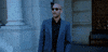 TV gif. Keegan-Michael Key, dressed in a suit outside a marble building, takes off his sunglasses and looks out in amazement while mouthing, "Holy shit," which appears as text.