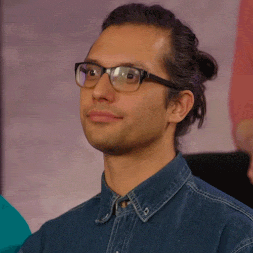 Video gif. A man wearing glasses and a denim collared shirt purses his lips and nods his head decisively.