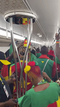 Cameroon Fans Dance and Sing on Metro 