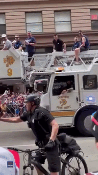 Officer Tries to Stop Player From Rejoining Parade