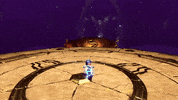 Video game gif. A clip of gameplay from the trailer for Playstation video game "Astro Bot" shows Astrobot, a small white robot with an LED screen face, running across a circular stone platform to engage in a boss fight against a villanous, mechanical python, whose cackling head rises from the ground, ready to attack. 