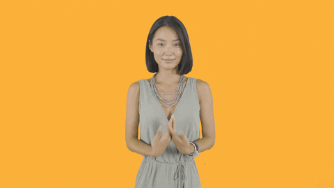TV gif. Elsha Kim as Yunjin Garcia of The Garcias places her palms together in front of her chest and bows in a "namaste" gesture.