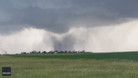 Lightning Strike Startles Storm Chaser While Filming Large Tornado in Nebraska