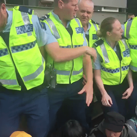 Police Remove Protesters Blockading 'Weapons Conference'