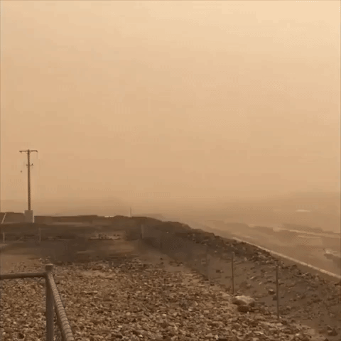 Dust Storm Blankets Outback Town in Orange Haze