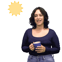 Video gif. Woman holding a mug in front of a transparent background leans to the side, smiling as she waves with fluttering fingers. She says, "Buenos dias," in Spanish, which appears as text beneath a spinning cartoon sun.