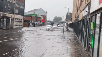 Cars Drive Through Floodwater in Port Talbot as Wales Hit by Heavy Rain