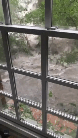 'We're Safe on the Upper Level' - Dallas Family Trapped Inside as Floodwaters Surge Past Home