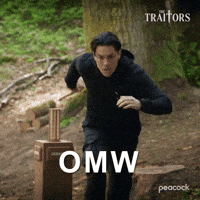 Sponsored gif. Traitors cast member Tom Sandoval in black tracksuit runs up a hill in a forest. Text reads, “O M W.”