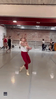 Ballet Dancer Holds Her Baby While Practicing at New York Studio