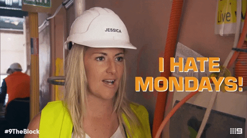Reality TV gif. Jess Eva on The Block wears a hard hat and a yellow vest. She shakes her head as she says, “I hate Mondays.”
