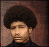 Video gif. Man with an afro is completely unamused, repeatedly shaking his head while staring straight at us.