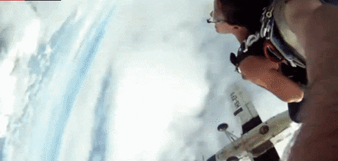 plane skydivers GIF