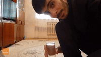 Man Performs Two-Finger Push-Ups While Drinking Water