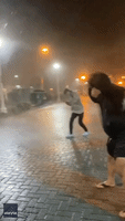 Locals Brave Strong Wind and Rain as Tropical Storm Ophelia Hits Coastal Virginia