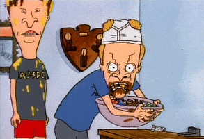 Cartoon gif. Wearing white briefs on his head, Beavis looks at us, crazed and gnashing his teeth while gripping a bowl of candy, and Butt-head stands to the side.