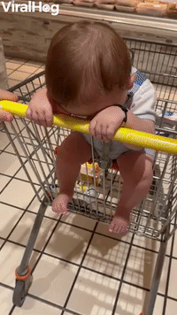 Baby Keeps His Head Down in Supermarket 
