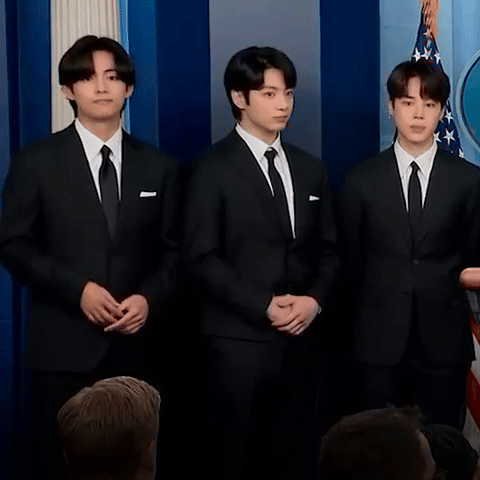 V and Jungkook react during press conference.