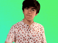 Celebrity gif. Declan McKenna looks at us with a serious expression, drops a mic, and turns away.