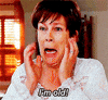 Movie gif. Jamie Lee Curtis as Tess in Freaky Friday looks into a mirror, grabbing her face, and screams, "I'm old!"