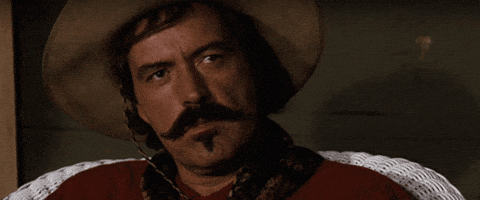 Movie gif. Powers Boothe as Bill in Tombstone gazes forward as if indifferent. Text, "Well... bye." 