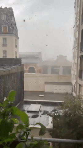 Roofing Blows Loose as Strong Winds and Torrential Rain Batter Paris