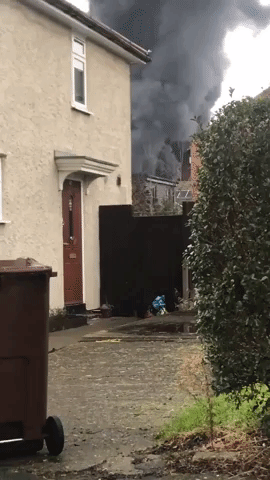 Smoke Billows From Car Repair Shop Fire in London