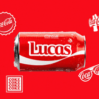 Sponsored gif. A red can of Coca-Cola with the name "Lucas" drops into frame, pauses, and then drops out of sight. Coca-Cola logos on bottle caps and sunglasses are in the background.