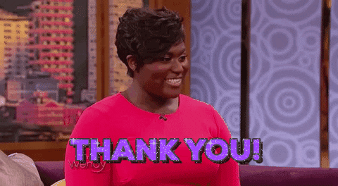 Celebrity gif. Danielle Brooks on the Wendy show smiles and looks out at an audience, gesturing his hand out as she says, “Thank you!” The text in front of her is purple and sparkles intensely. Text, “Thank you!”