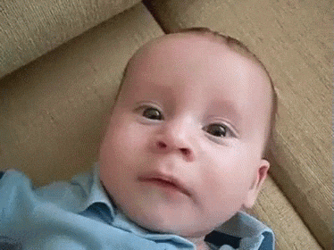Video gif. Baby's face gets dramatically suddenly sad, frowning and then sobbing.