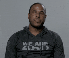 Video gif. Dion Waiters of the Miami Heat rolls his eyes and slumps back in his looking annoyed during an interview.