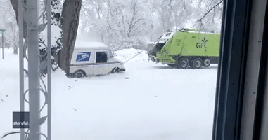 Michigan Garbage Truck Pulls USPS Truck From Snowbank