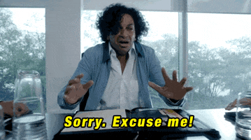 TV gif. In a scene from The X-Files, a man at the head of a conference room table in an office freaks out, standing up as he shakes uncontrollably and runs off, saying, “Sorry, excuse me!”