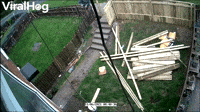 Guy Tearing Down Fence Takes a Tumble
