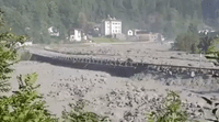 Swiss Village Evacuated as Mudslide Deforms Traffic Barriers