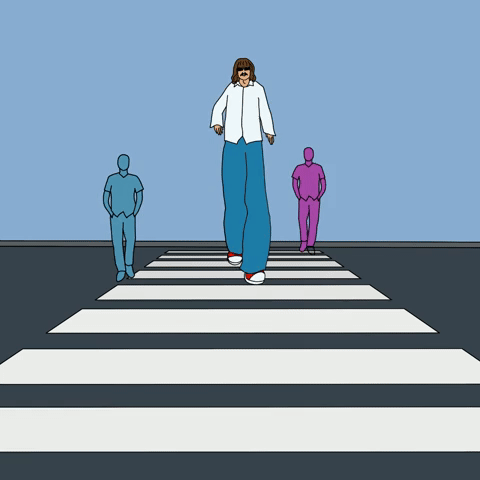 Giant man crossing the road