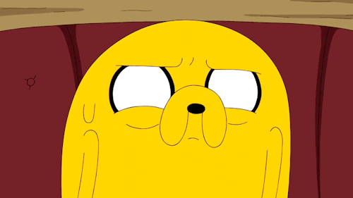 Cartoon gif. Jake the Dog from Adventure Time squints, and one eyelid twitches.