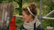 TV gif. We pull out quickly from a woman on The Great Pottery Throwdown. She leans into a high five another woman who we see move into frame. 