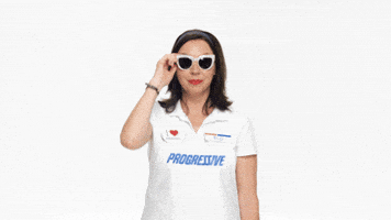 Ad gif. Flo from Progressive pulls her sunglasses down and winks at us. Her wink sparkles. 