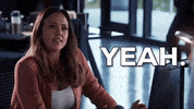 TV gif. Jessica Alba as Nancy in L.A.'s Finest. She sits at a desk and looks up at someone before trying to convincingly say, "Yeah!"