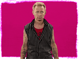 Celebrity gif. Mike Dirnt looks confused as he shrugs with his arms out to the side while question marks pop up around him.