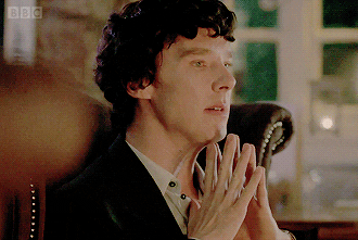 TV gif. Benedict Cumberbatch as Sherlock Holmes on Sherlock touches his fingers together, almost in a prayer position. He closes his eyes and rests his chin on his fingers until he intertwined his hands and winces like he’s thinking hard.