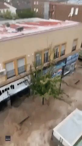Raging Floodwaters Carry Cars Through Streets in Madrid Suburb