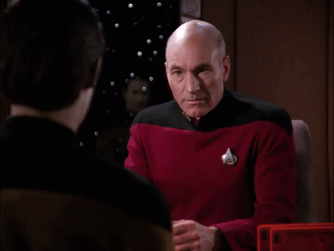 TV gif. Patrick Stewart as Captain Jean-Luc from Star Trek. He looks intensely at the man he's speaking to before closing his eyes in disappointment and putting his head in his palms. He seems utterly gutted.