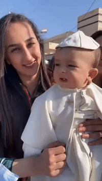 Baby Pope and Dancing Priest Among Those Celebrating Papal Visit to Qaraqosh