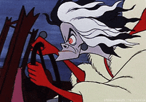 Disney gif. Cruella De Vil from the 101 Dalmatians cartoon drives, hunching over the steering wheel and hair flying in the wind. Her eyes are red with a wild rag and she frowns, jutting her chin out.