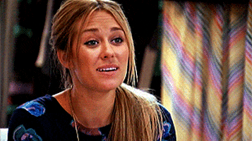 TV gif. Lauren Conrad puts her hands together and rests them under her chin as if saying "aww" to something sweet.