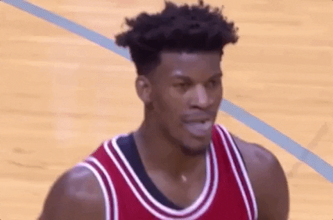 Sports gif. On the court at an NBA game, Jimmy Butler of the Chicago Bulls raises his eyebrows as if to say, “Really?”